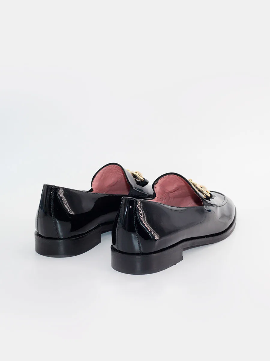 Black patent leather embellished Messina loafers.