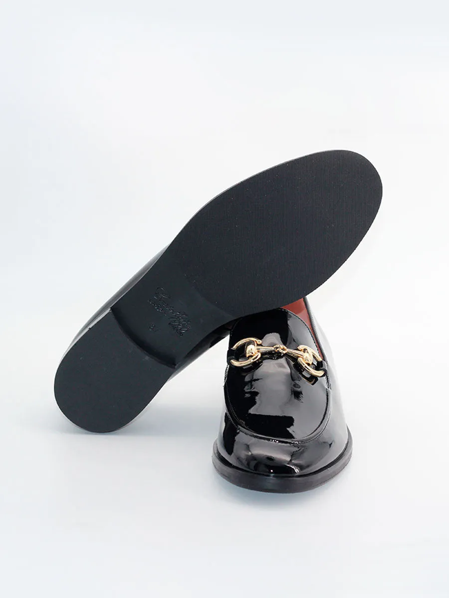 Black patent leather embellished Messina loafers.