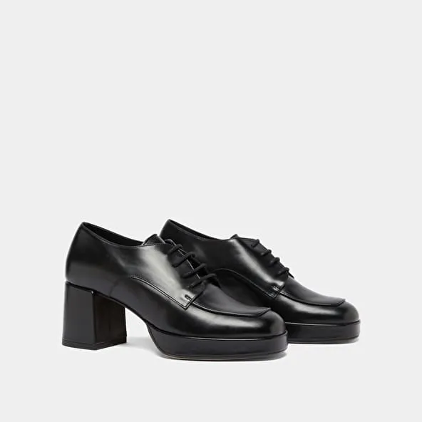 Derbies with heels in black leather