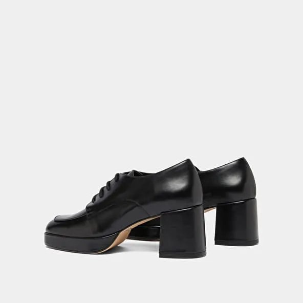 Derbies with heels in black leather