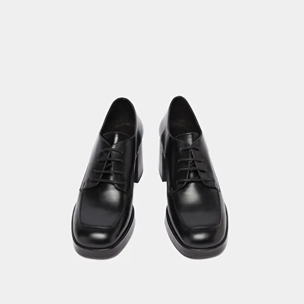 Derbies with heels in black leather