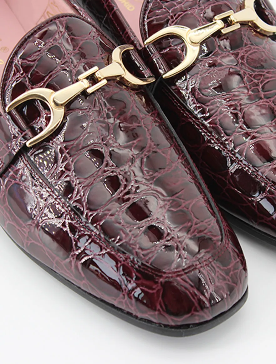 Burgundy patent leather Giverny moccasins.