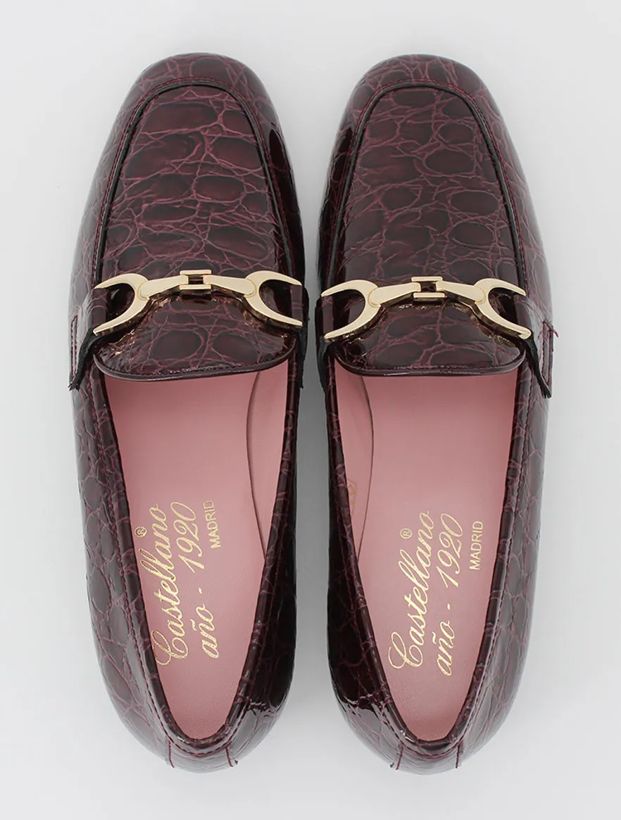 Burgundy patent leather Giverny moccasins.