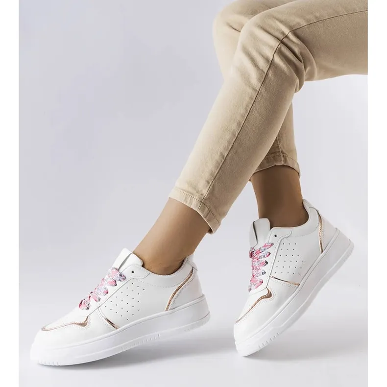 White sneakers tied with Pryor ribbon